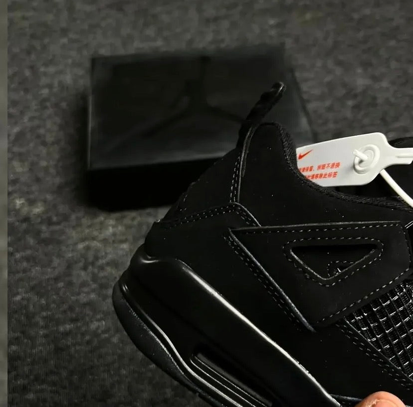 Black Jordan 4’s