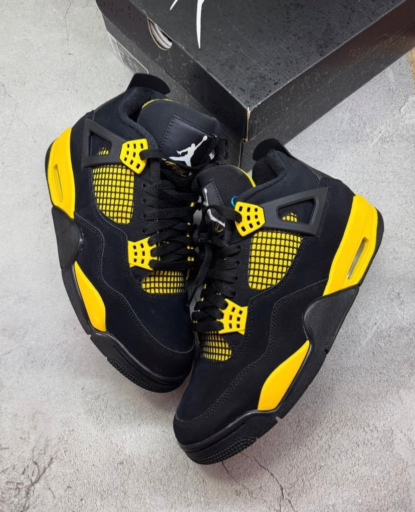 Black & yellow Jordan 4’s
