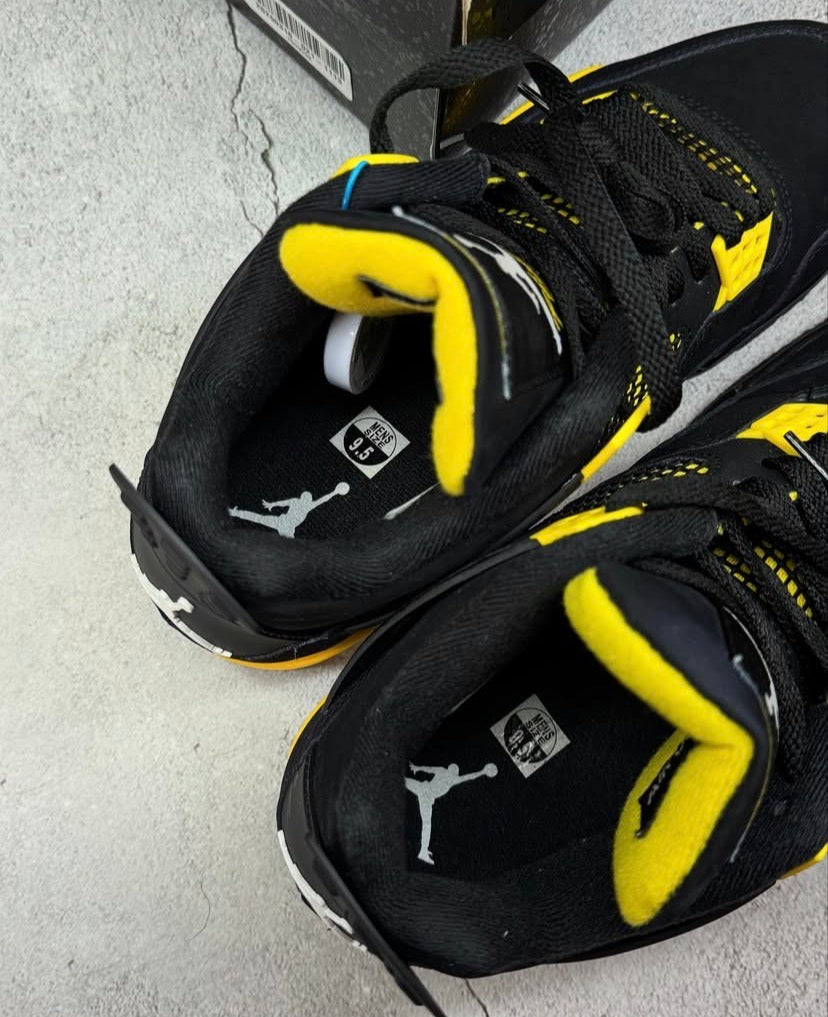 Black & yellow Jordan 4’s