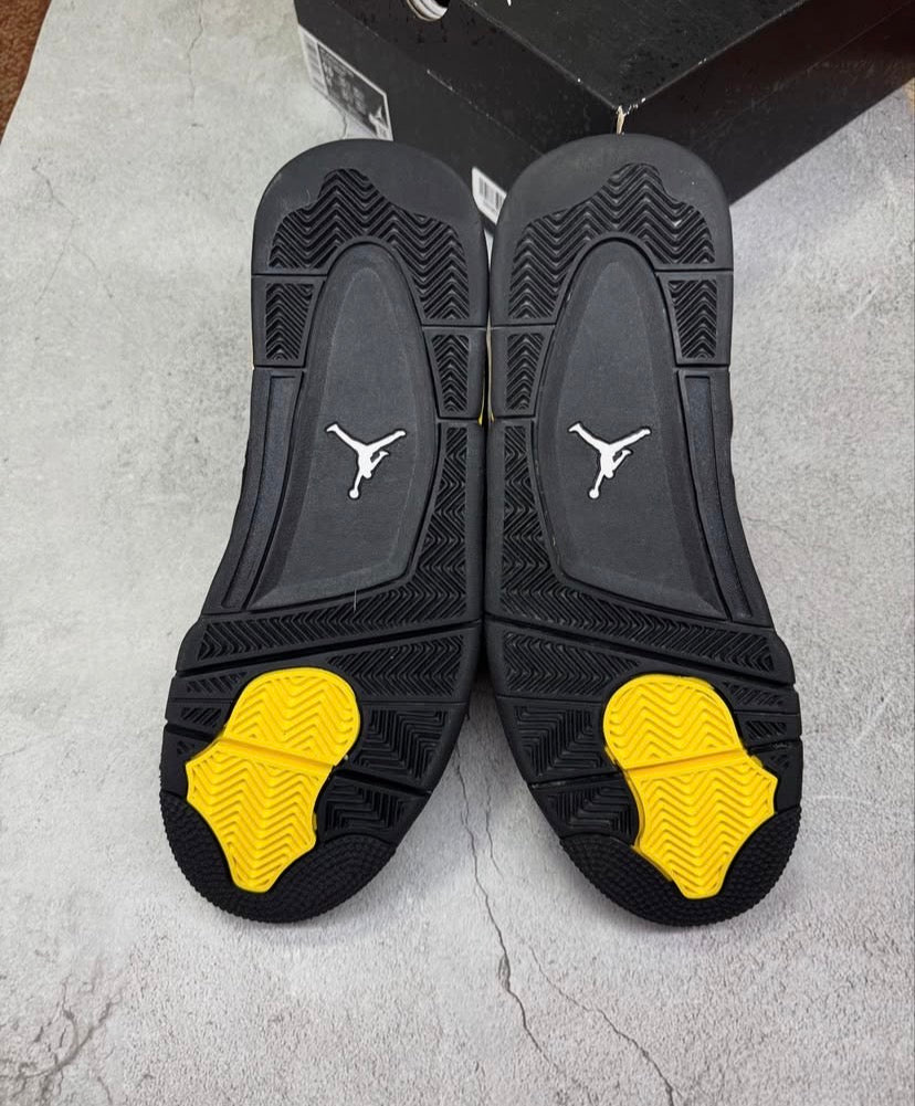 Black & yellow Jordan 4’s