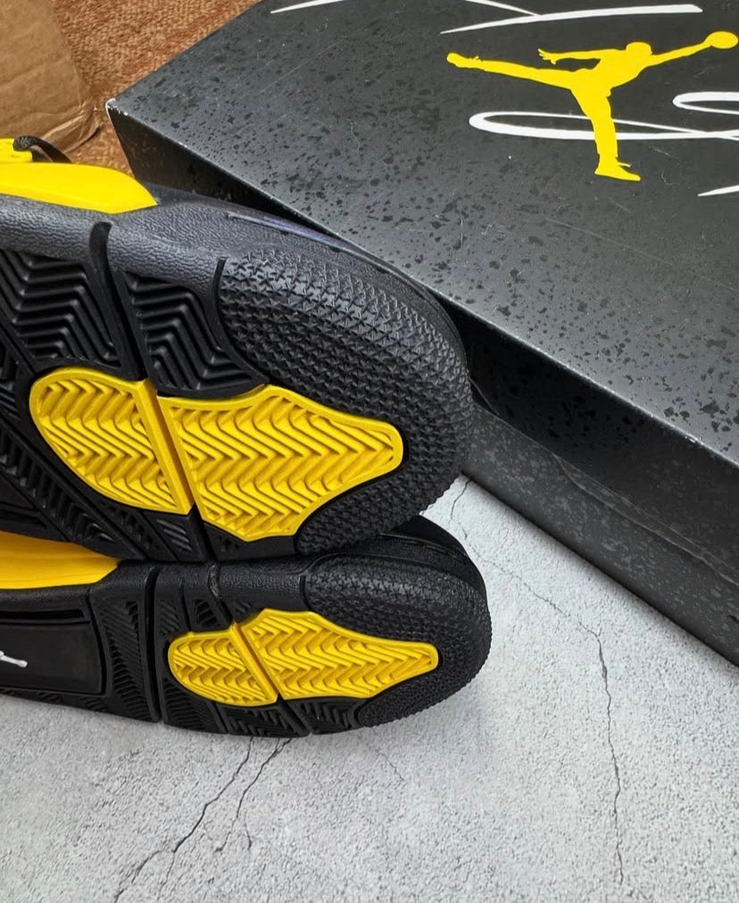 Black & yellow Jordan 4’s