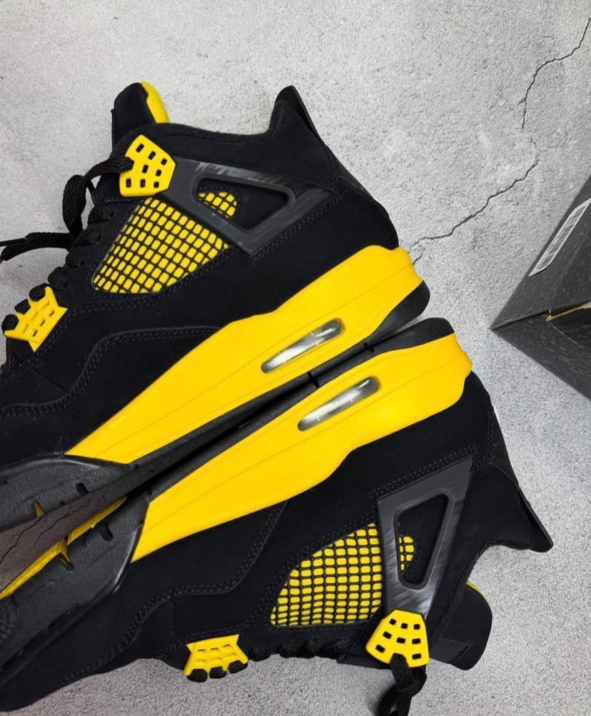 Black & yellow Jordan 4’s