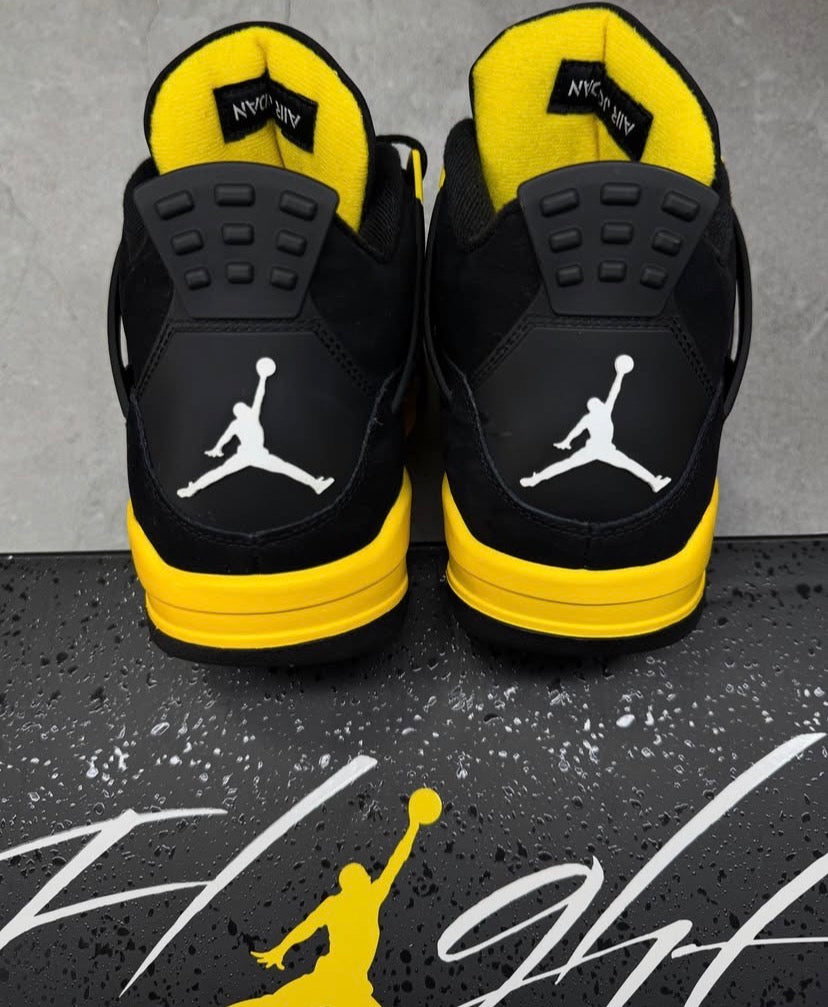 Black & yellow Jordan 4’s