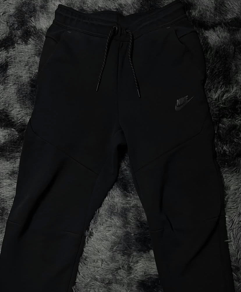 Black Nike tech pants