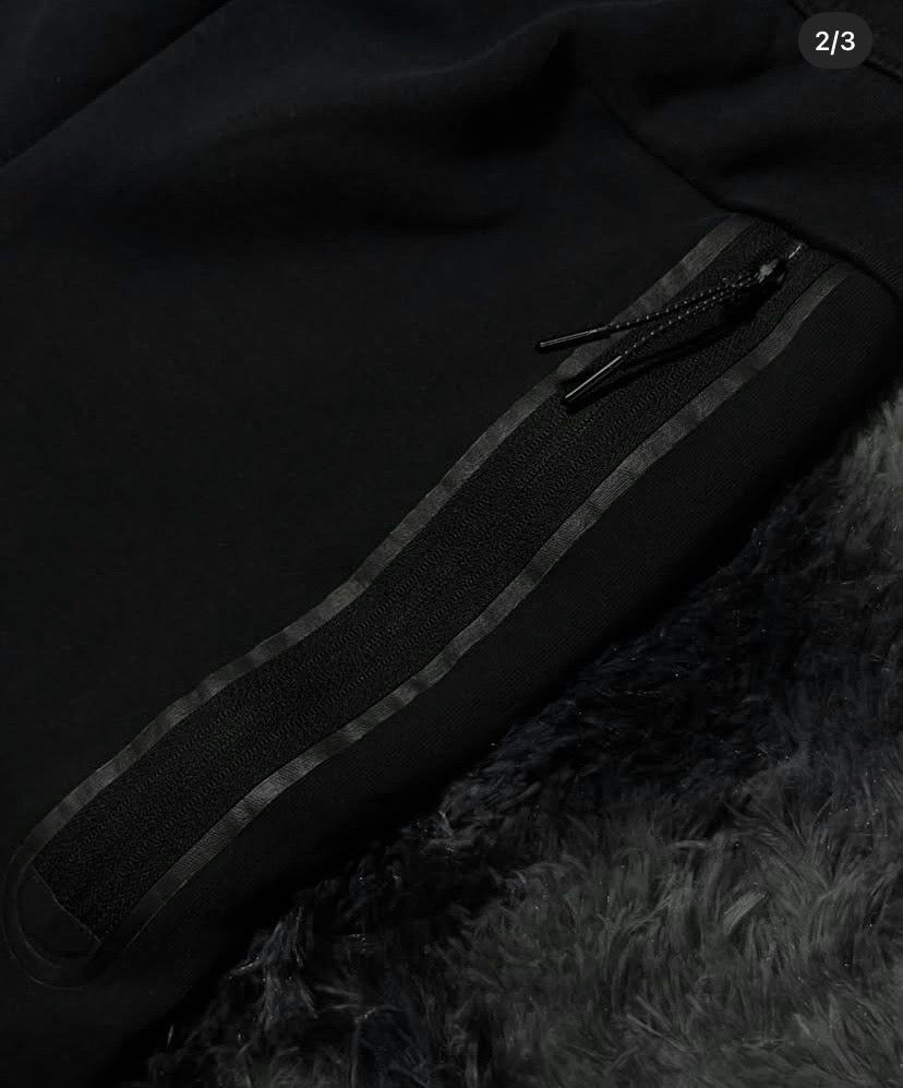 Black Nike tech pants