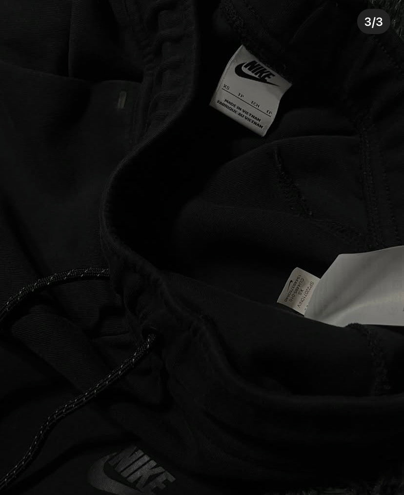 Black Nike tech pants